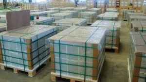 Pallets of premium ceramic and porcelain tiles ready for export, showcasing our efficient logistics and global reach.